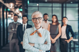 A leader standing in front of her team