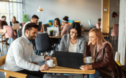 A group of colleagues sitting together enjoying their work